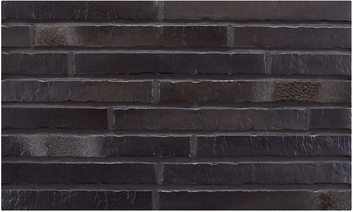 Dark gray brick wall.