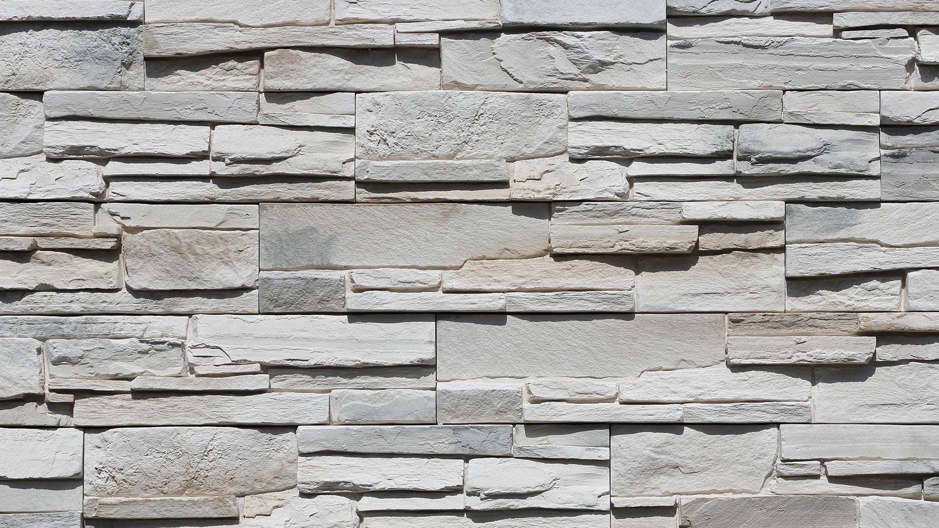 Gray stacked stone wall texture.