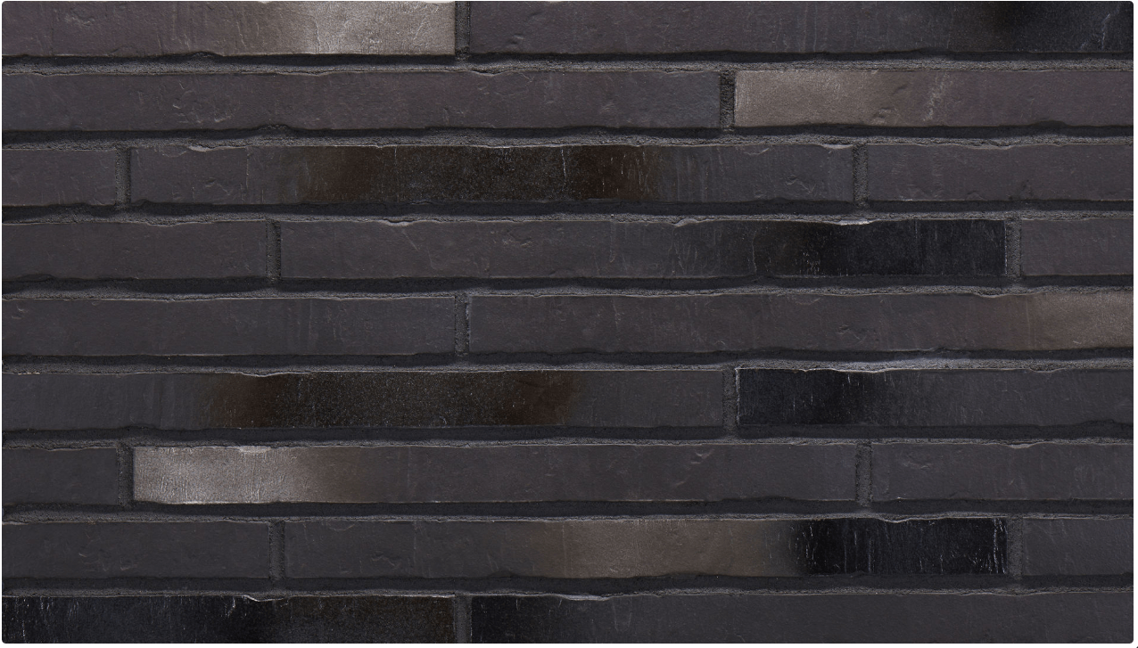 Black brick wall with reflective, silvery sections.