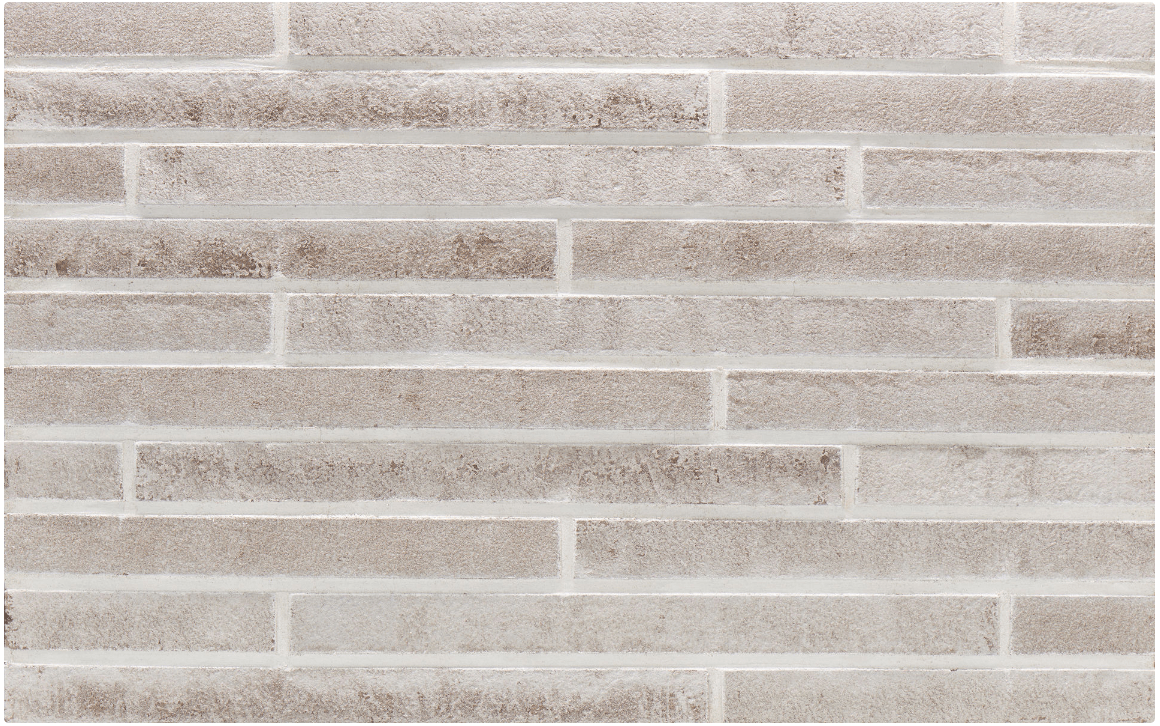 Brick-like wall tile. Rectangular beige tiles with darker brown edges are arranged in a staggered pattern.