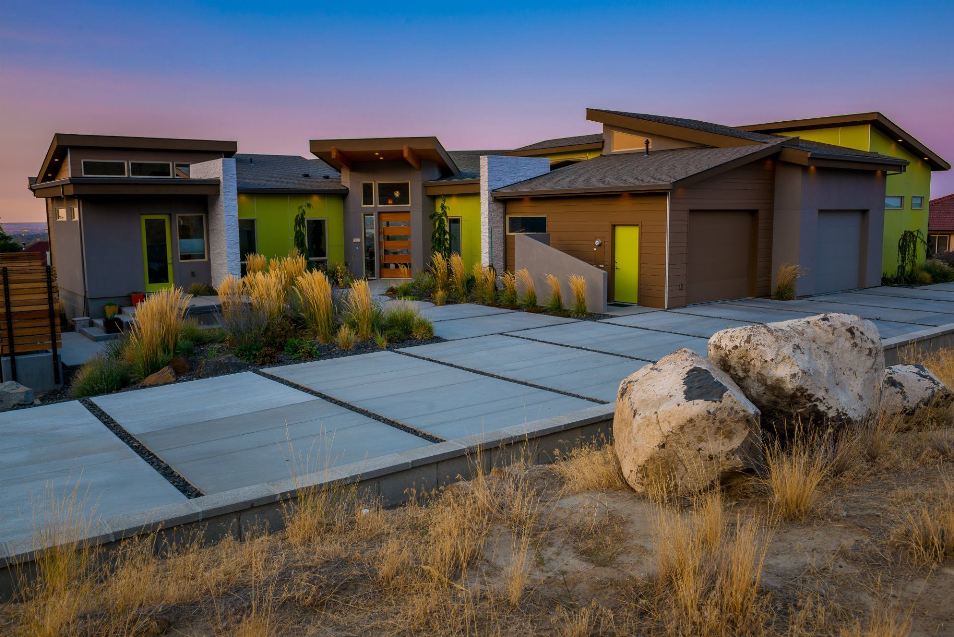 A large house with a lot of rocks in front of it.