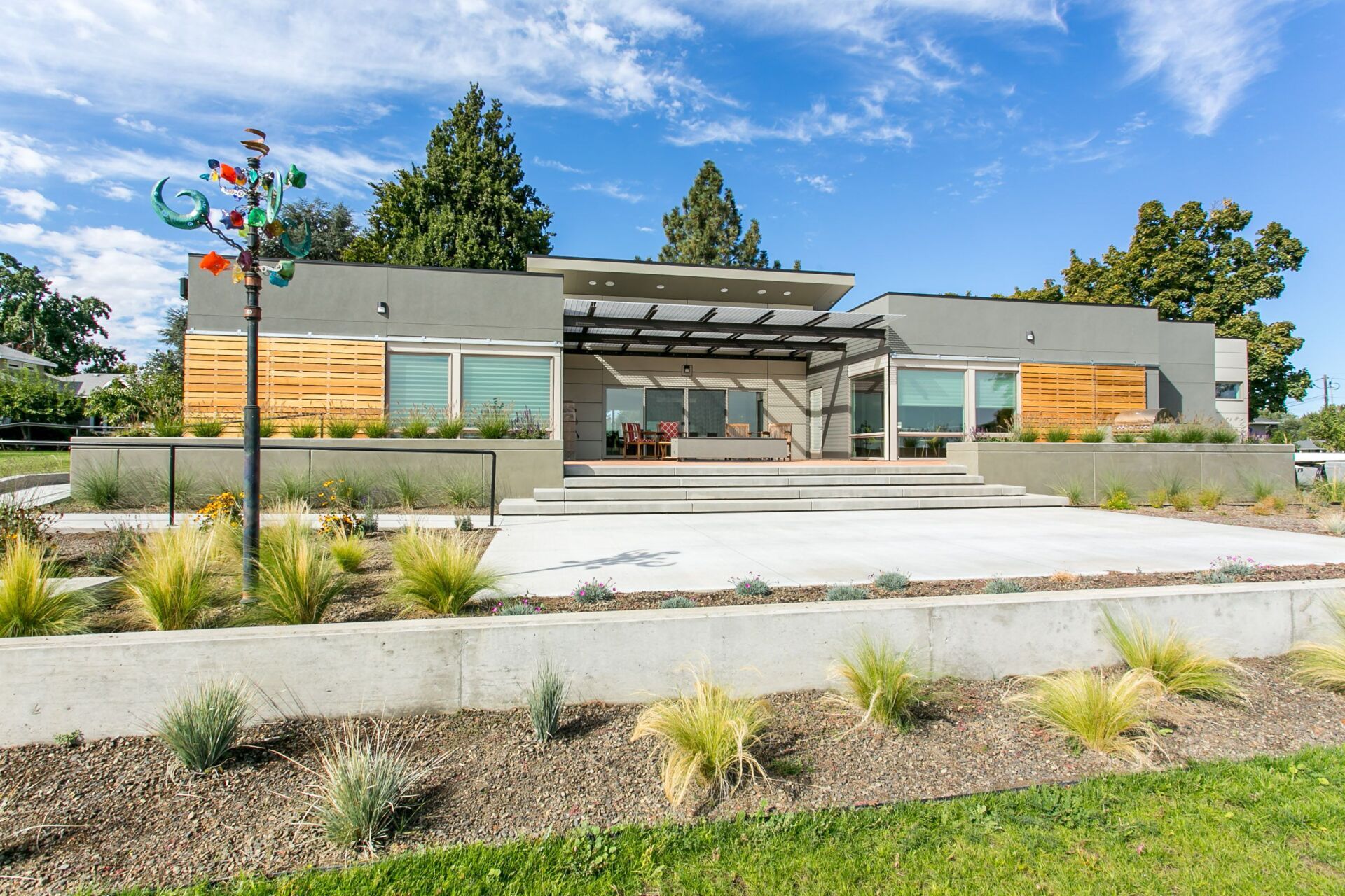 A modern house with a windmill in front of it