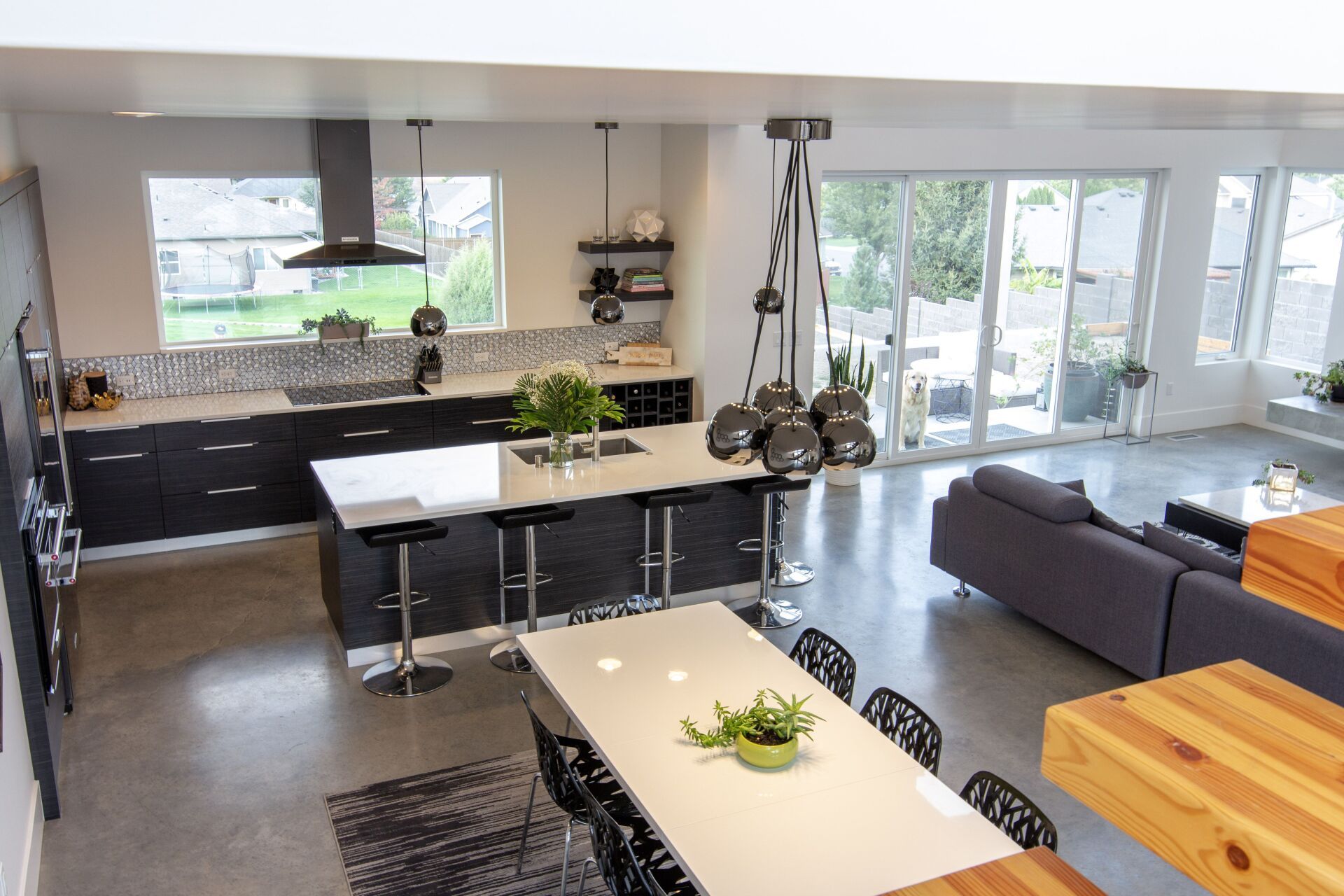 A kitchen with a table and chairs in it
