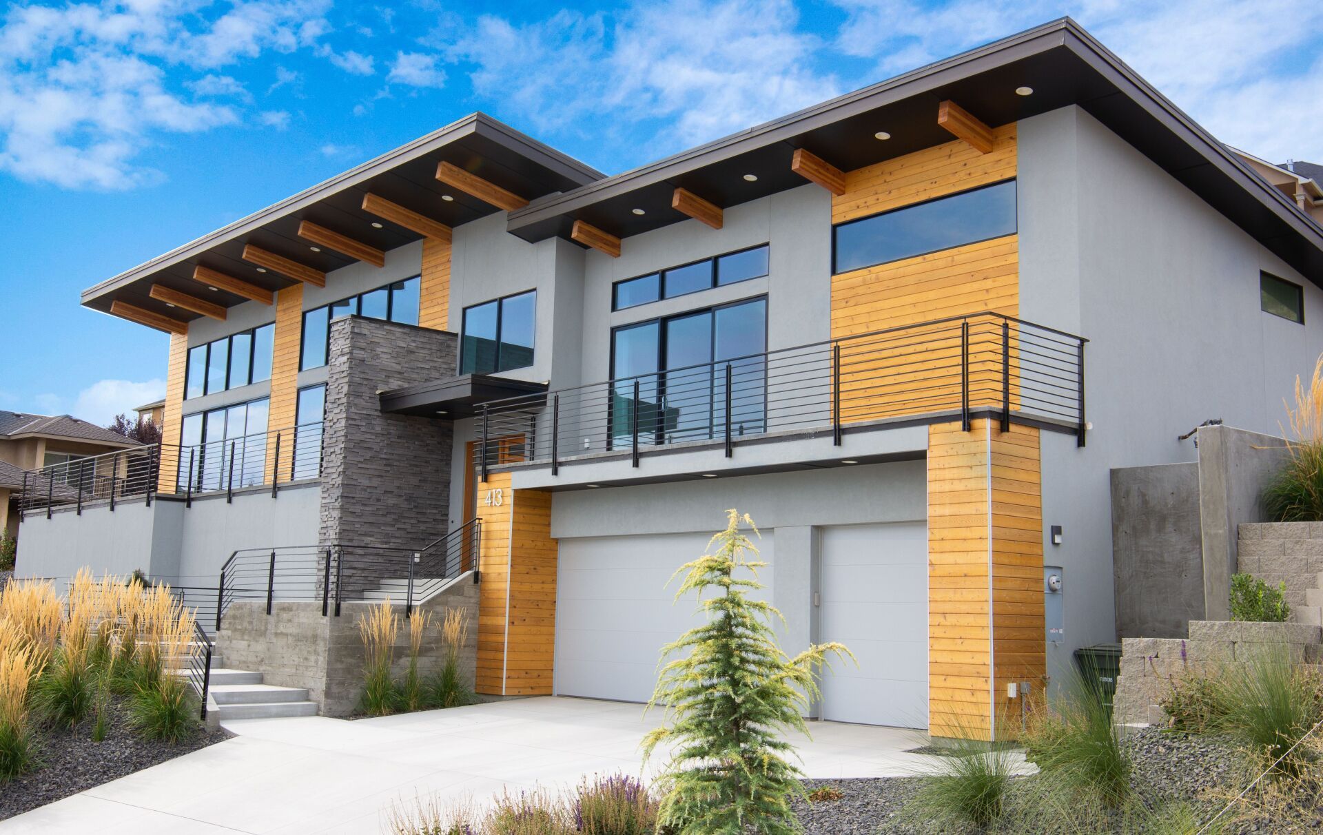 A large house with a lot of windows and a balcony.