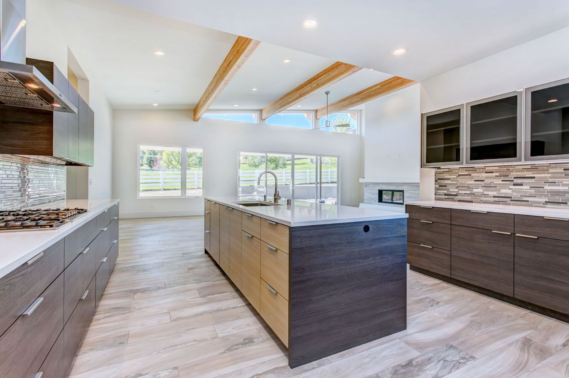 A kitchen with a large island in the middle of it.