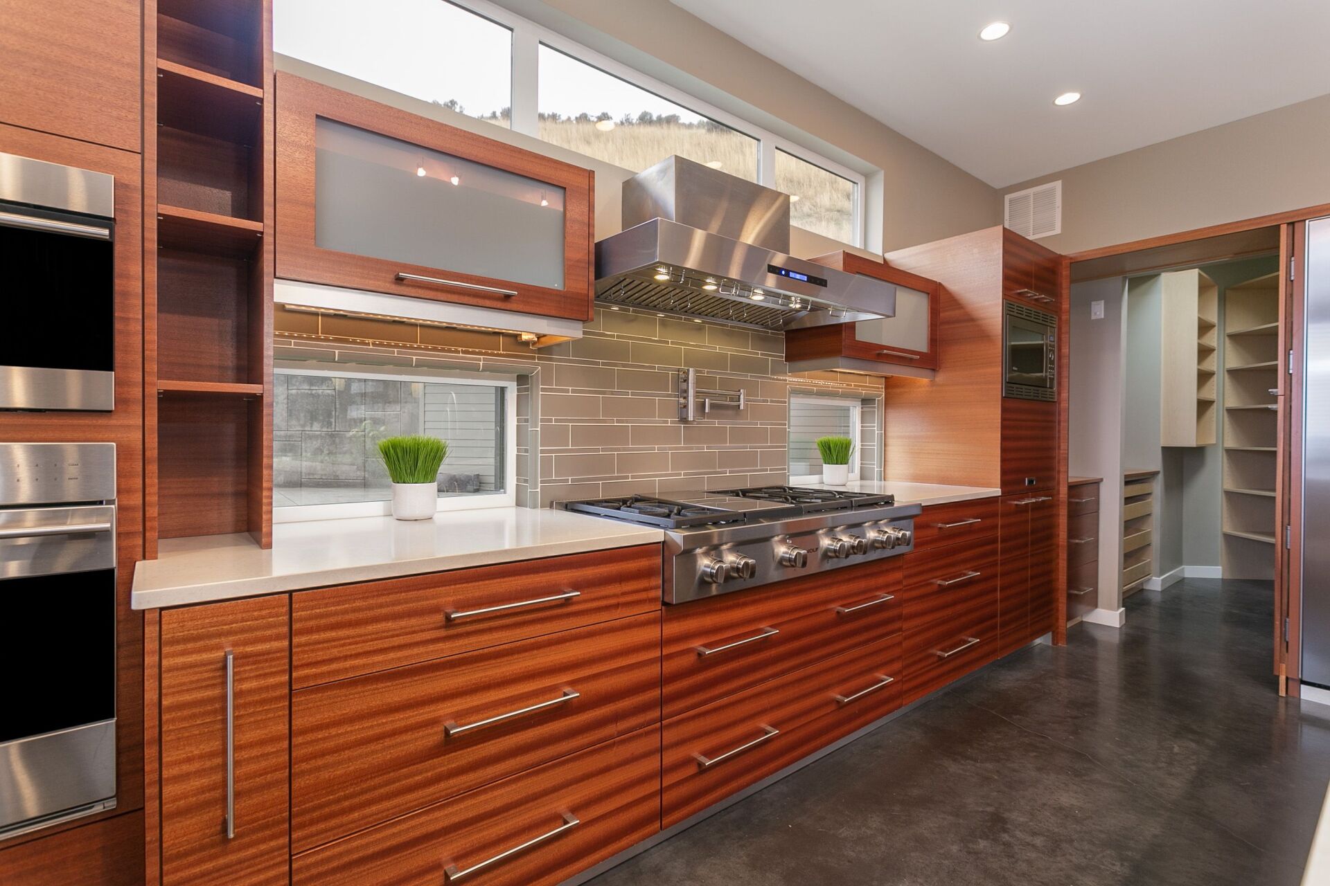 A kitchen with wooden cabinets and stainless steel appliances