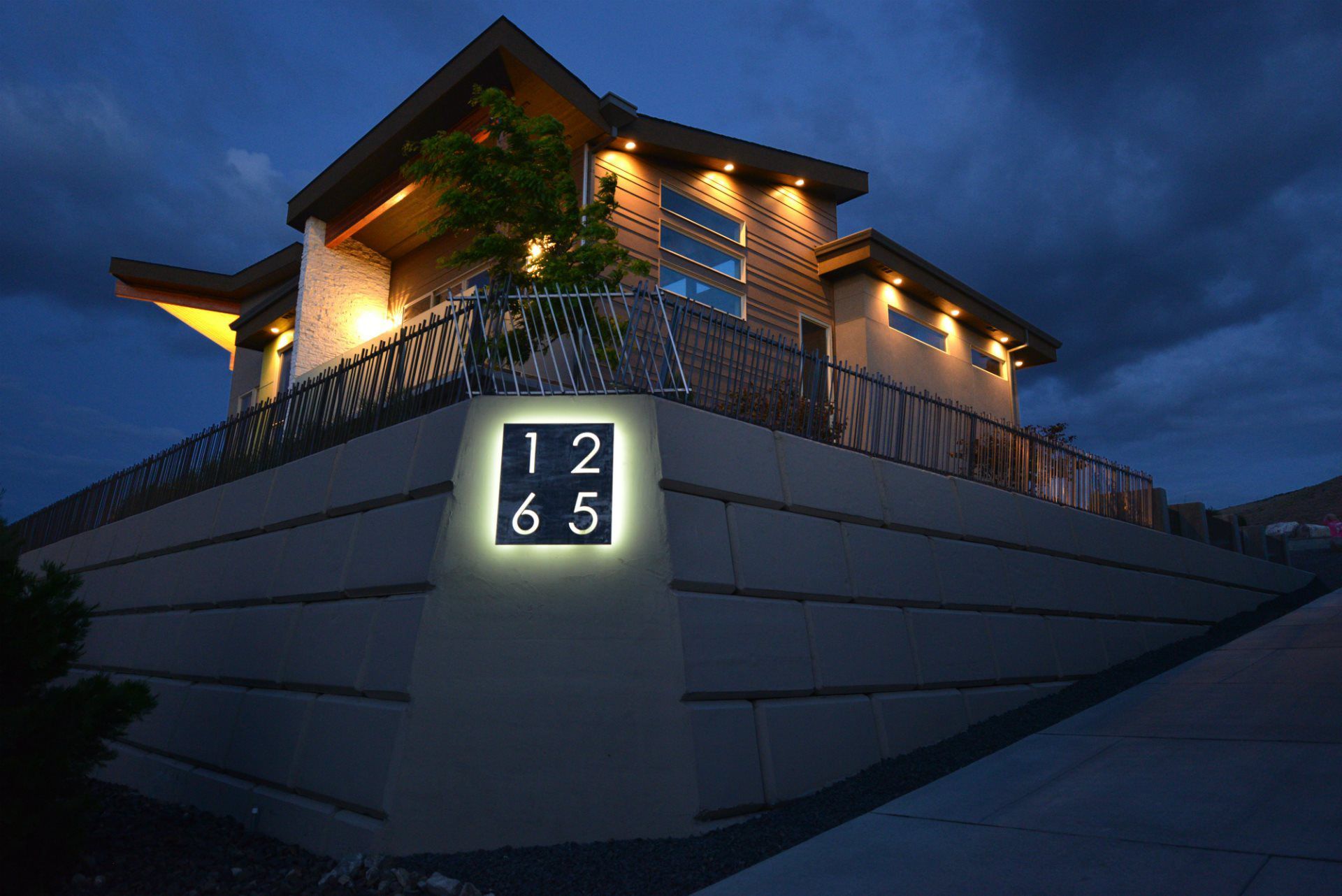 A house with the number 12 65 on the side of it