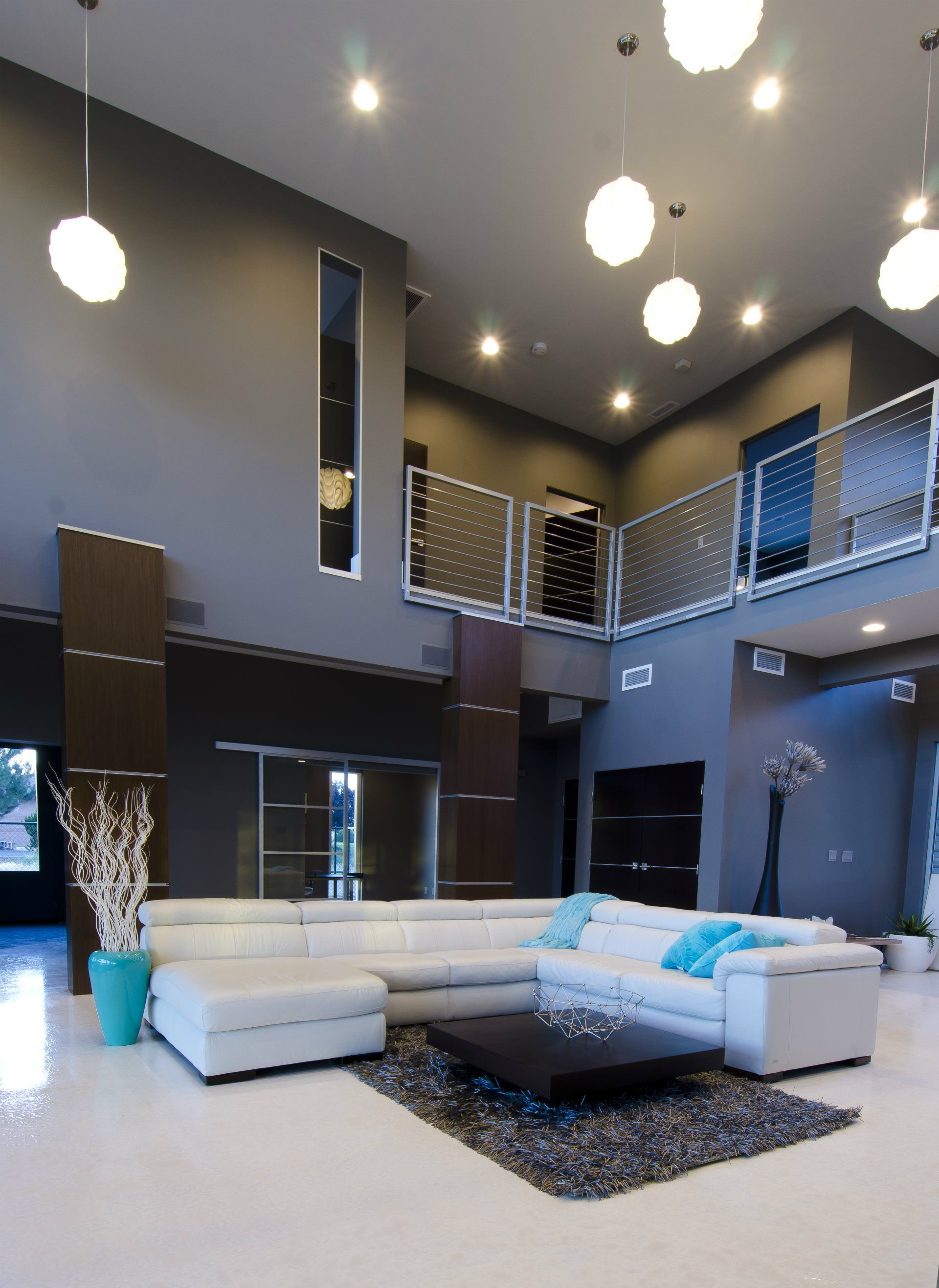 A living room with a large sectional couch and a coffee table