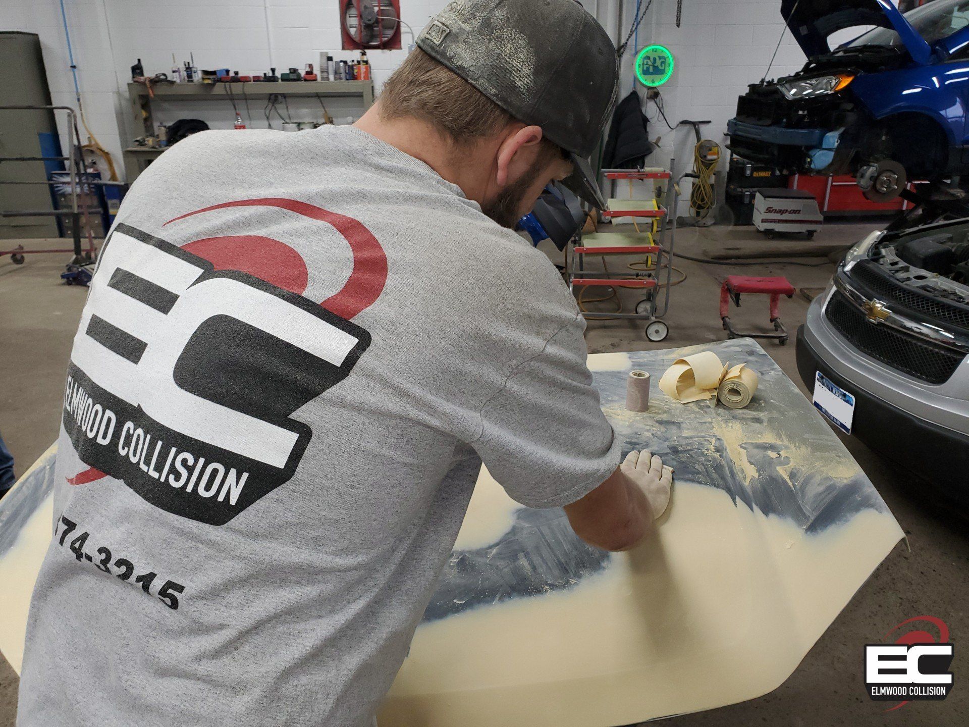 Sanding a Hood at Elmwood Collision in Tonawanda New York