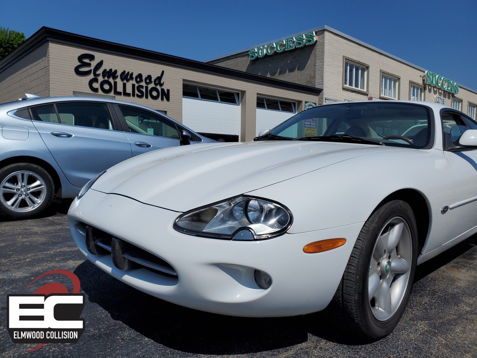 1998 Jaguar XK8 parked outside Elmwood Collision in Tonawanda New York