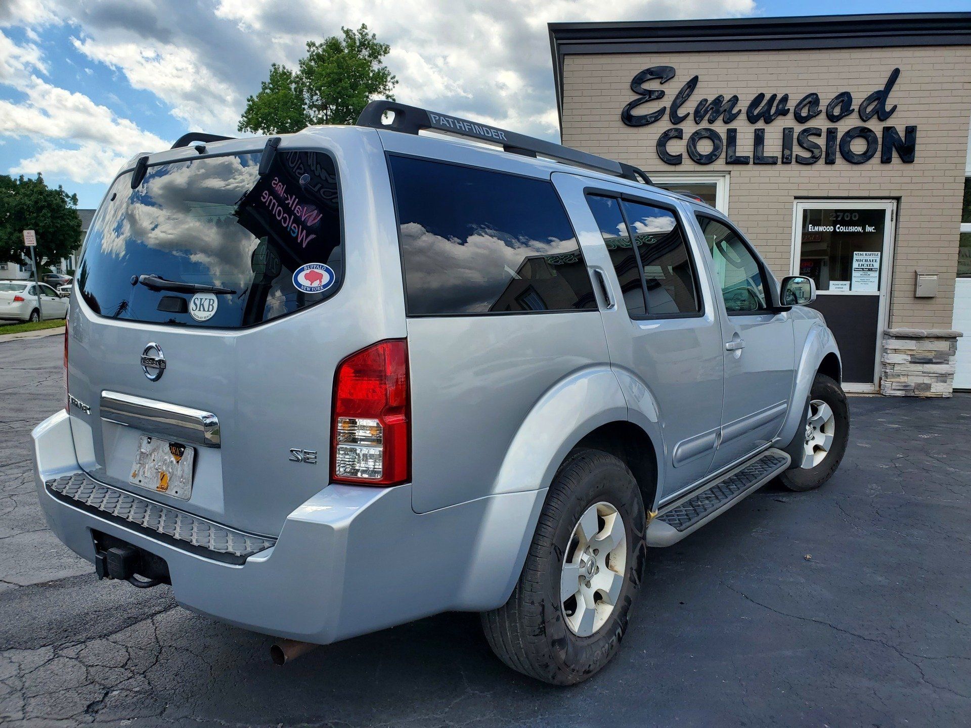 2007 Nissan Pathfinder outside Elmwood Collision
