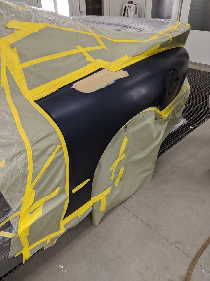 2000 Trans Am primed and ready for paint inside paint booth at Elwmood Collision