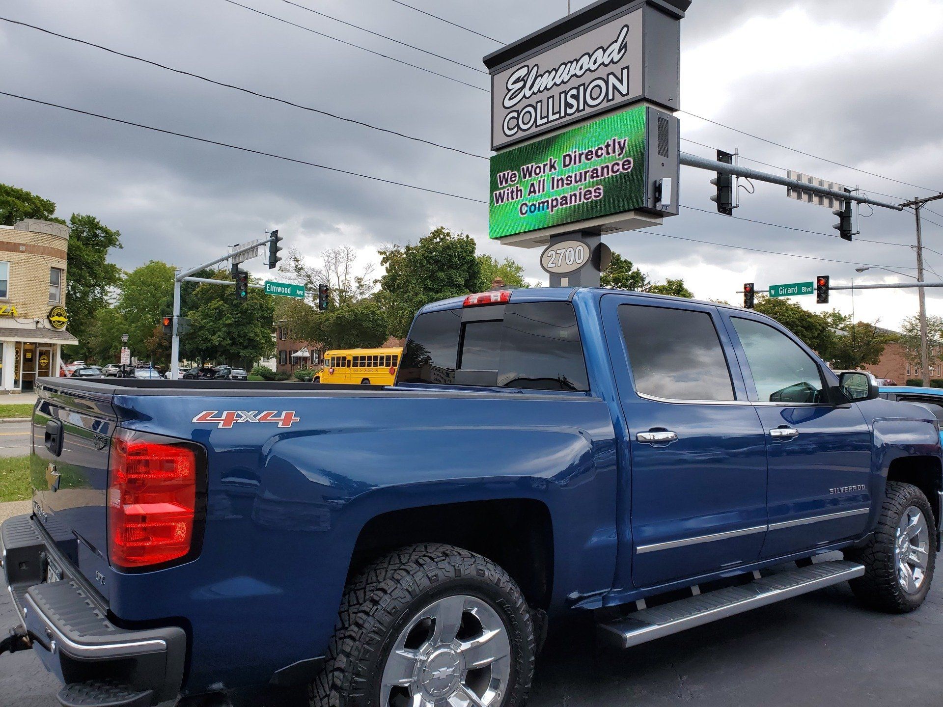 2015 Chevy Silverado parked outside Elmwood Collision