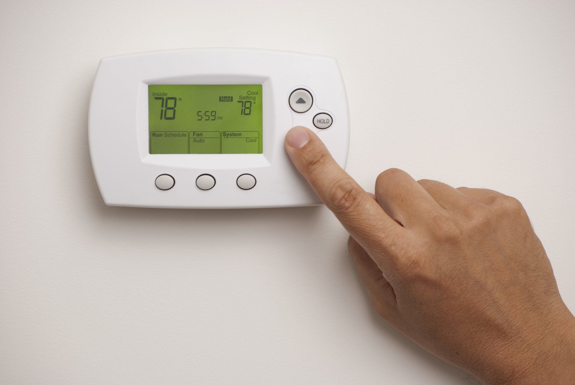 Technician Repairing Air Conditioner — Appalachia, VA — Better Air Heating and Cooling Man Turning on Air Conditioner — Appalachia, VA — Better Air Heating and Cooling