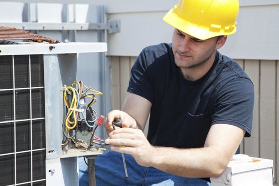 Man Turning on Air Conditioner — Appalachia, VA — Better Air Heating and Cooling Man Turning on Air Conditioner — Appalachia, VA — Better Air Heating and Cooling