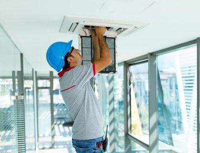 Worker Installing Air Conditioner — Appalachia, VA — Better Air Heating and Cooling Worker Installing Air Conditioner — Appalachia, VA — Better Air Heating and Cooling