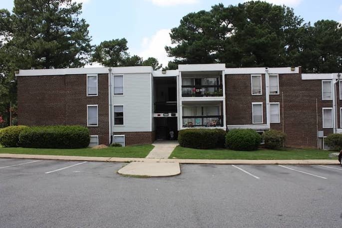 Three-story, red brick apartment building