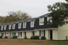 Green Castle Apartments Two-story, dutch-style apartment building