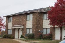 Meadows Townhomes Two-story brick apartment building
