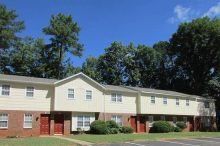 Westcliffe Apartments Two-story apartment building with yellow siding/brick exterior