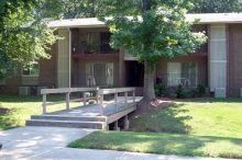 Plaza Apartments (Crestwood Drive) Two-story, brick apartment buildings surrounding by trees