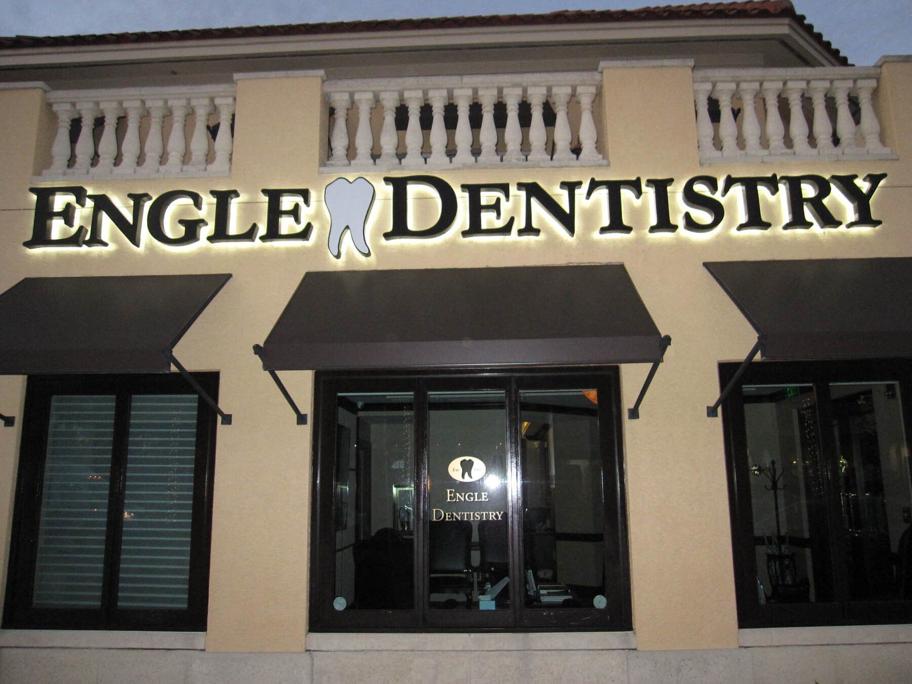 A building with a sign that says engle dentistry