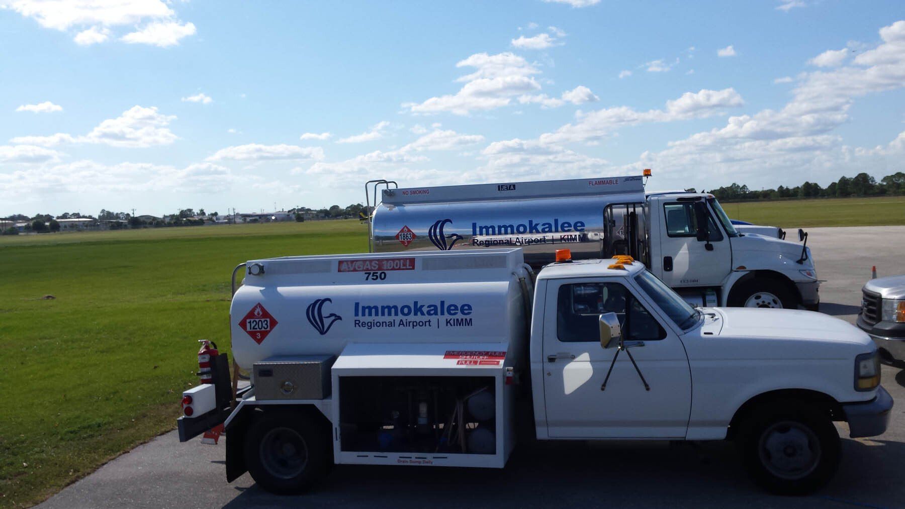 A white truck with farmkalee written on the side