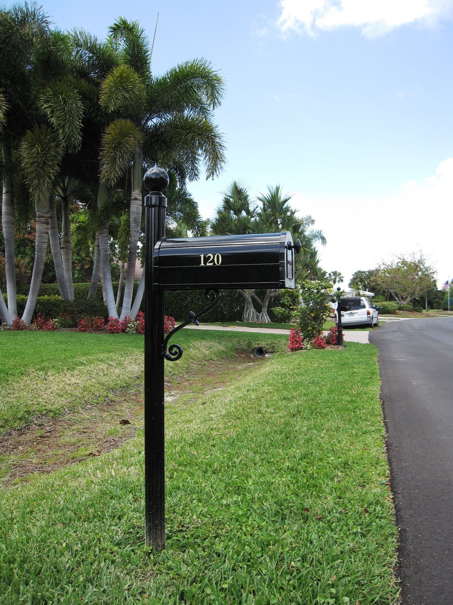 A black aluminum decorative mailbox.