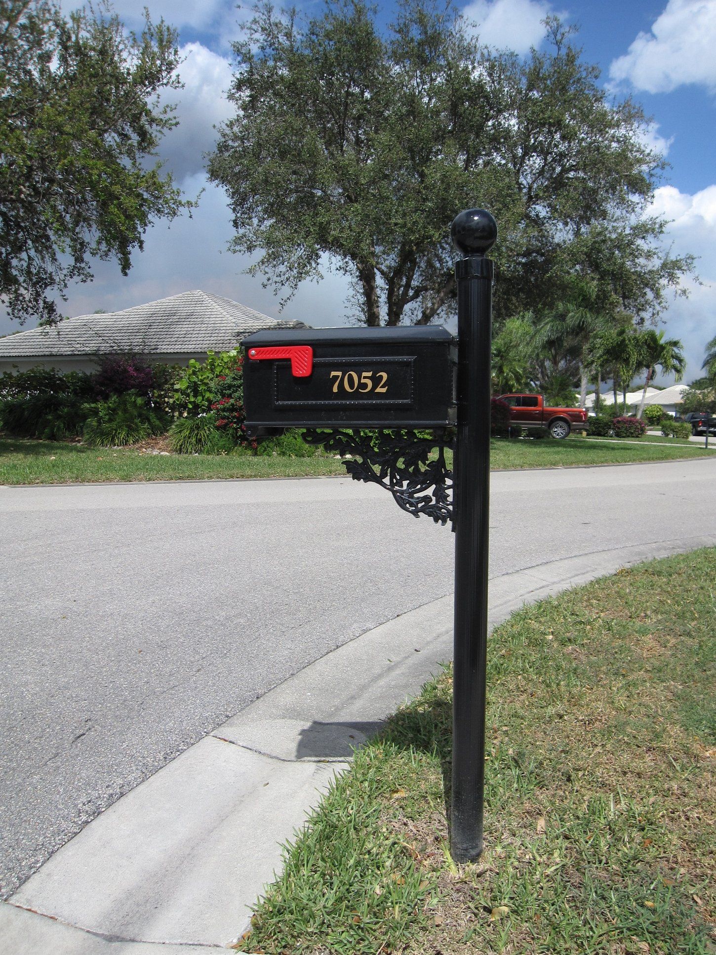 A black aluminum decorative mailbox.