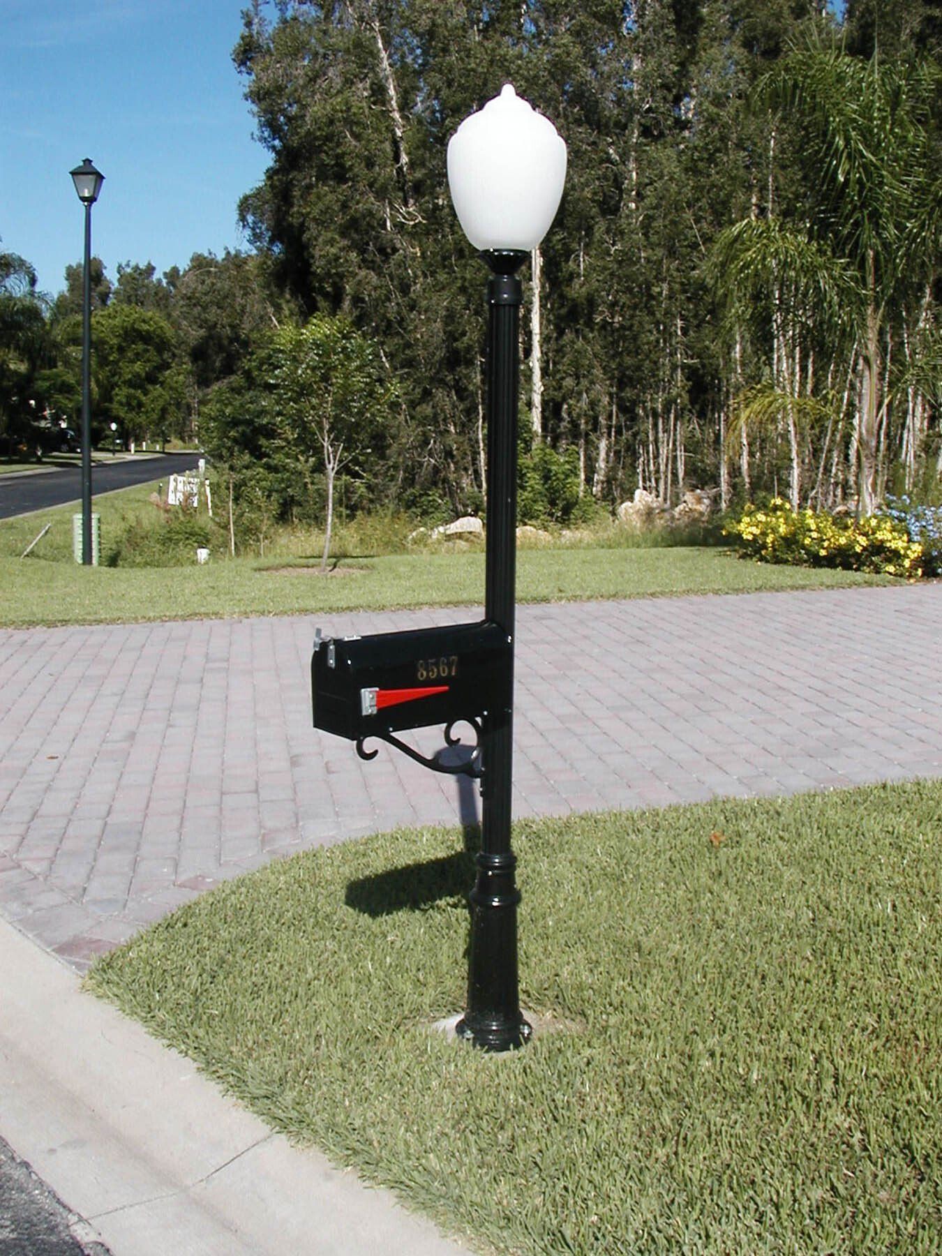 A black aluminum decorative mailbox with a light fixture.