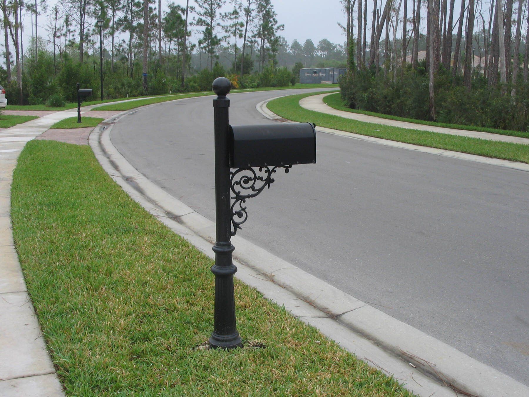 A black aluminum decorative mailbox.