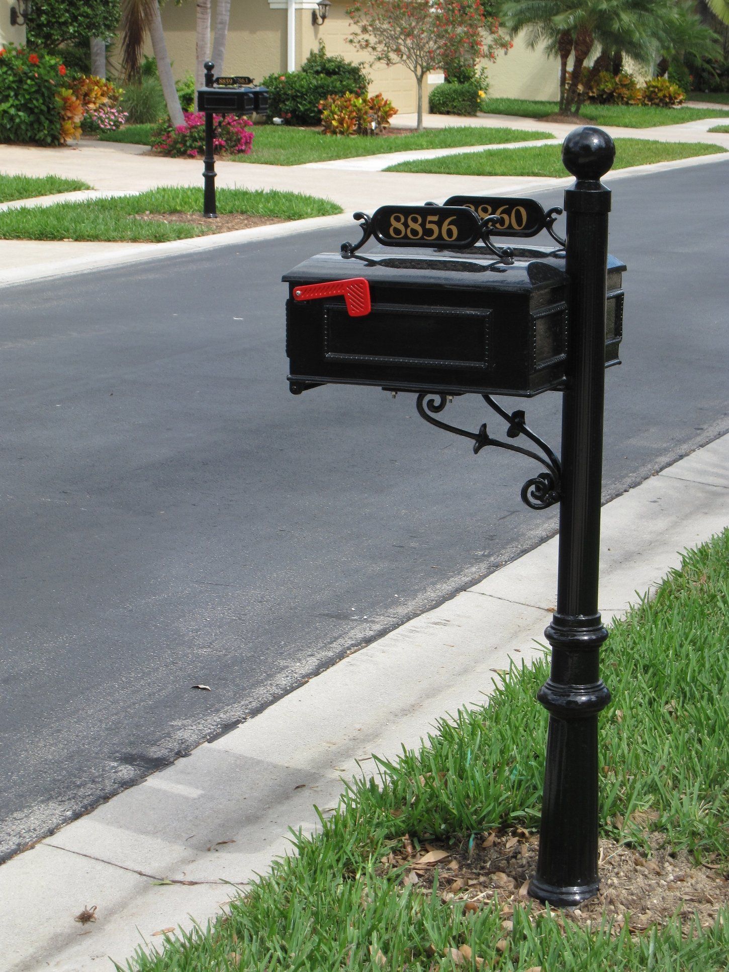 A black aluminum decorative double mailbox.