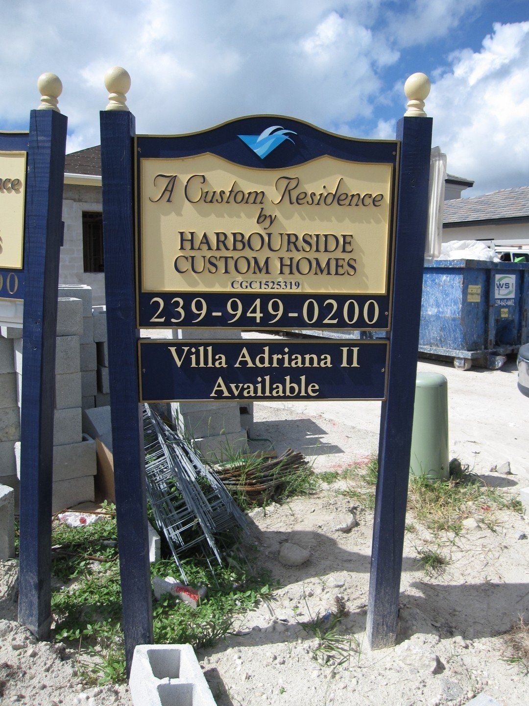 A sign that says a custom residence harbourside custom homes