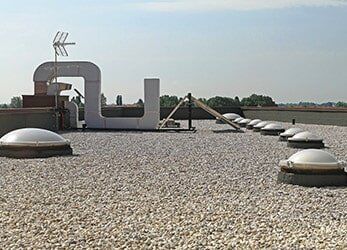 Gravel Flat Roof — Commercial Contractors in Salem, OR Gravel Flat Roof — Commercial Contractors in Salem, OR
