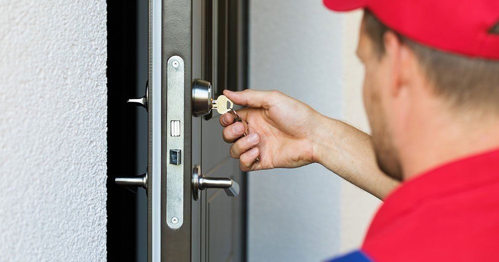 Commercial Locksmith Using Key to Test Lock