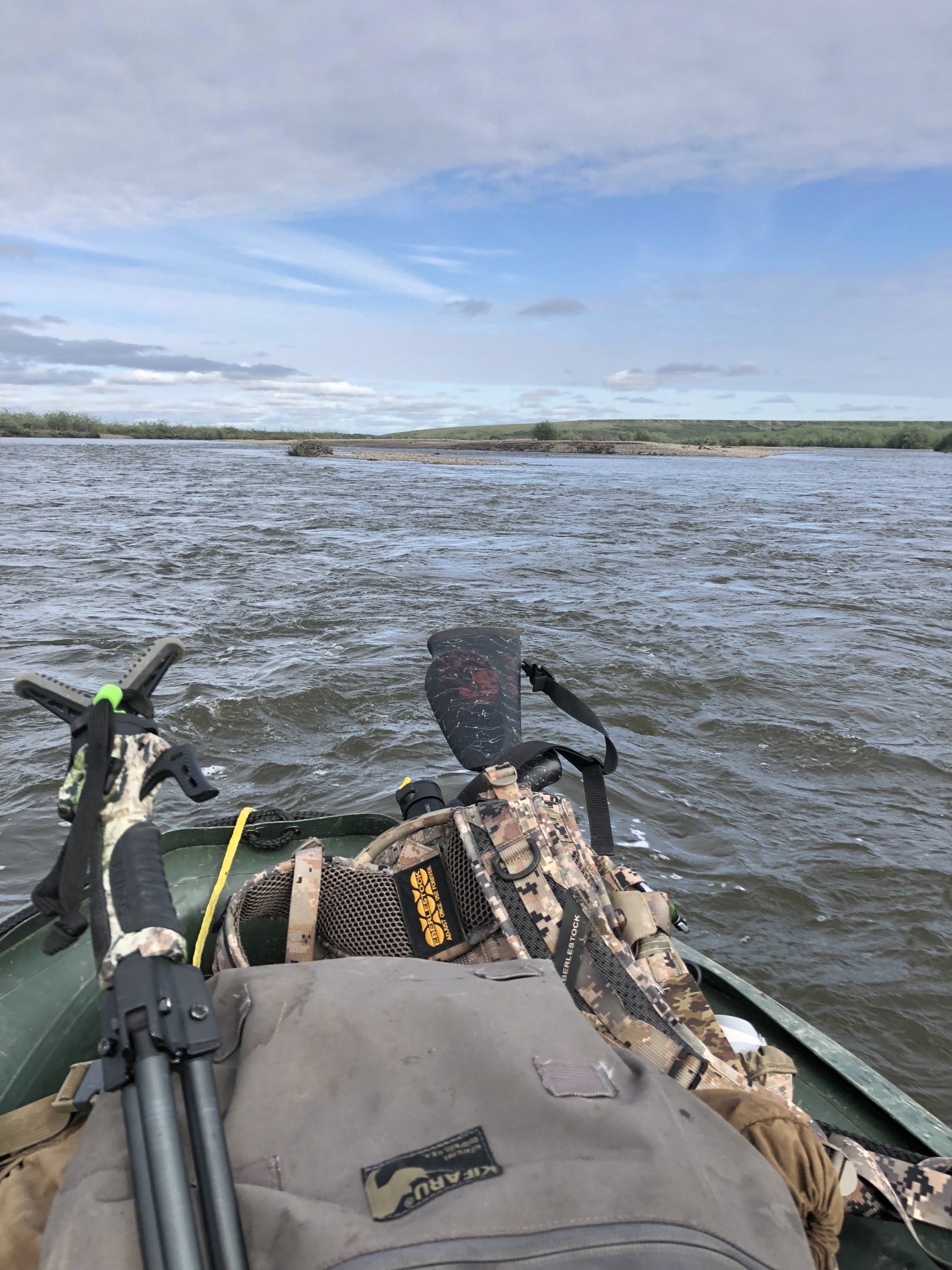 A boat is floating on top of a body of water.