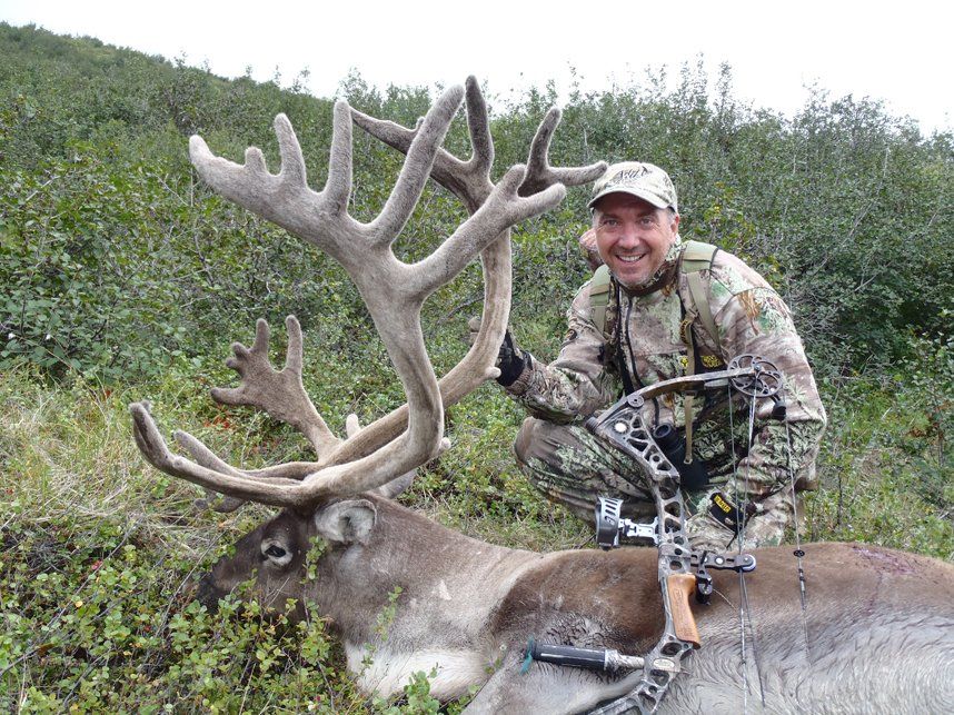 guided caribou hunter tom miranda with a nice bull taken with alaska arctic adventures