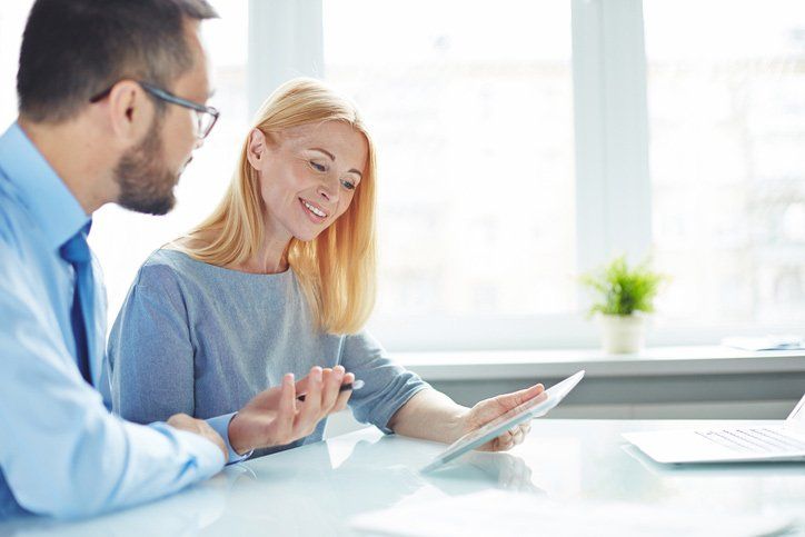 two people looking at tablet