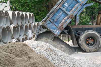 Topsoil — Dump Truck Dumping Rocks in San Antonio, TX Topsoil — Dump Truck Dumping Rocks in San Antonio, TX