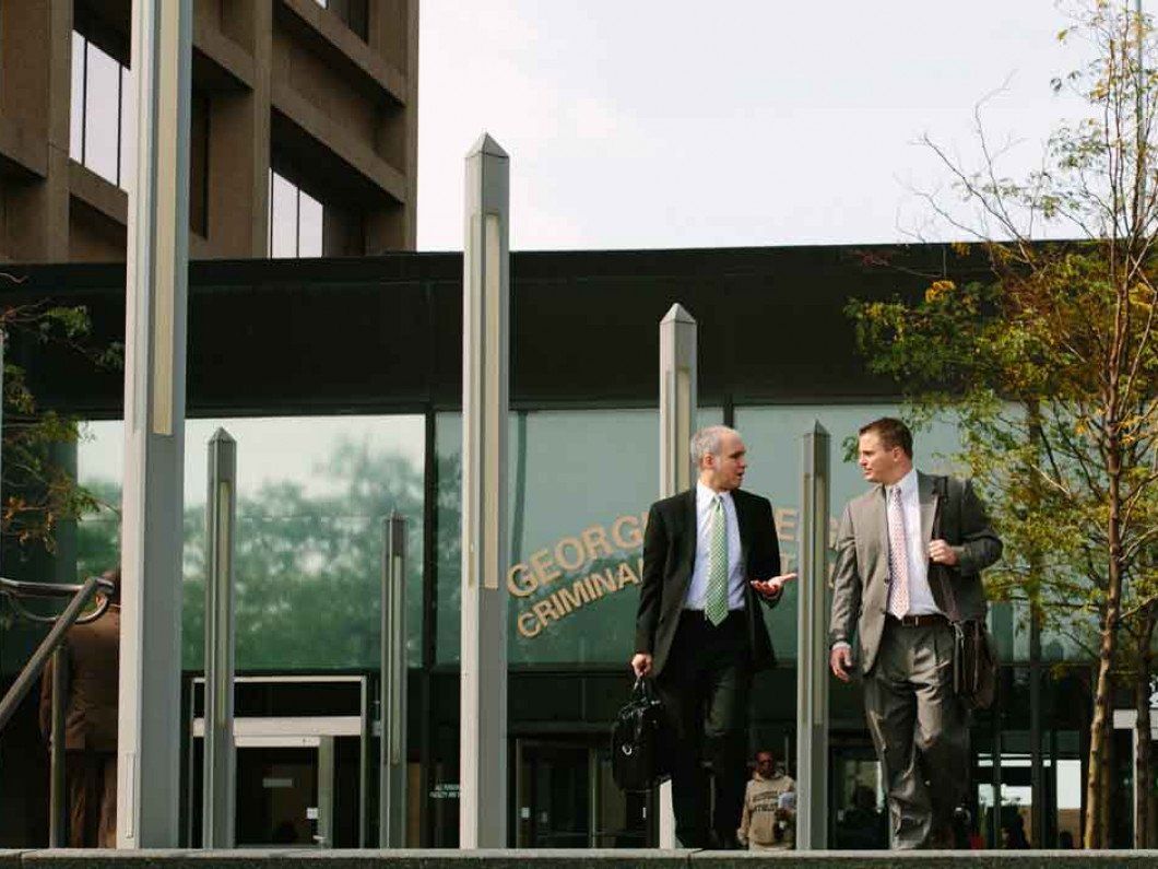 two lawyers chatting while walking