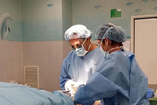 doctor performing foot surgery