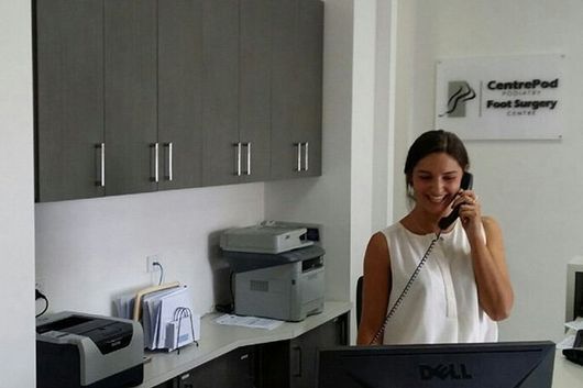 woman on the phone in doctors office
