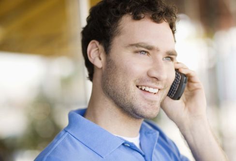A Melbourne man on the phone to an auto electrician