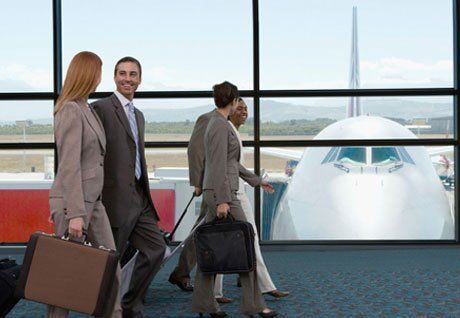 executives walking out of the airport