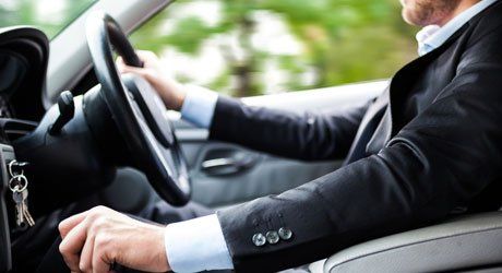 man sitting on the drivers seat