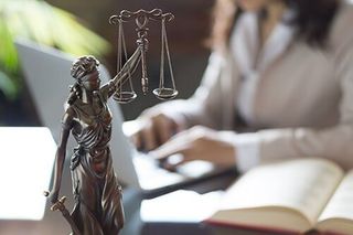 Lawyer working on laptop — Law Office in Indianapolis, IN Lawyer working on laptop — Law Office in Indianapolis, IN