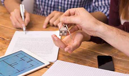 Hands Receiving House Key - Law Services in New Brunswick, NJ