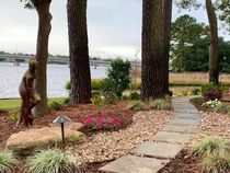 Female Statue Next To Flowers And Tall Trees — Virginia Beach, VA — Gentle Rain Female Statue Next To Flowers And Tall Trees — Virginia Beach, VA — Gentle Rain