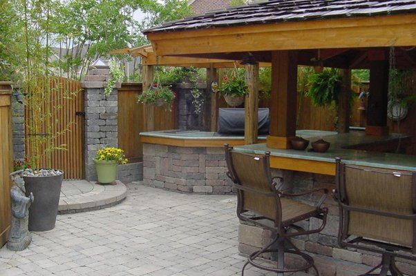 Outdoor Stone Area With Wooden Supporting Structures — Virginia Beach, VA — Gentle Rain