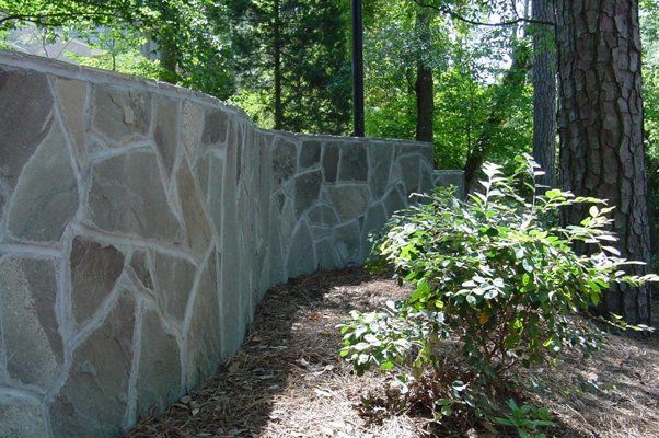 Stone Wall With Nice And Intricate Details Next To Grass — Virginia Beach, VA — Gentle Rain